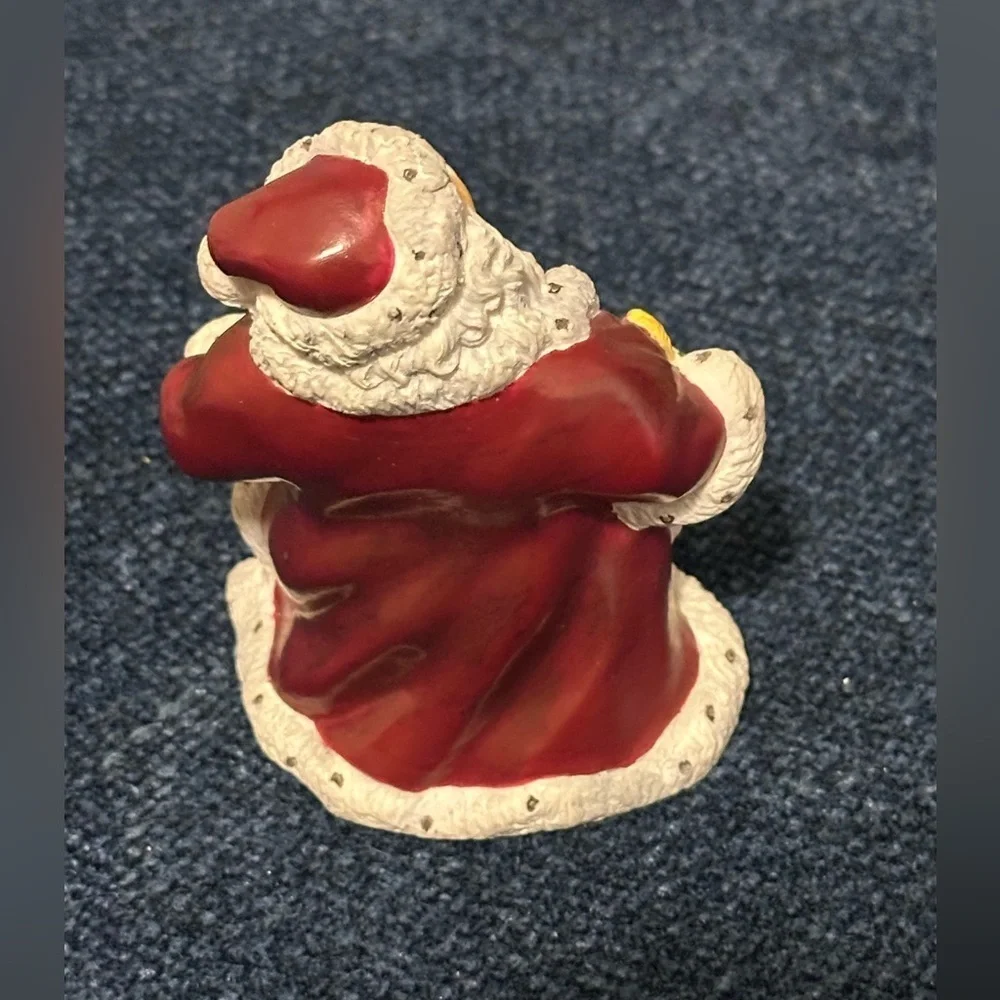 Small Santa with stars on his robe by Lenox’s Collectors Treasury of Santa’s.